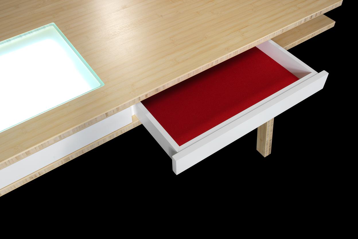 Tisch mit Schubkasten von Tischlerei Krogull Detailaufnahme eines maßgefertigten Tisches mit integriertem Schubkasten und beleuchtetem Glaselement.